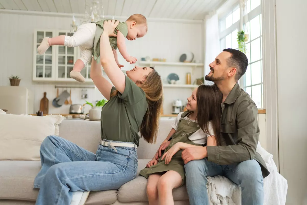 parents holding their baby